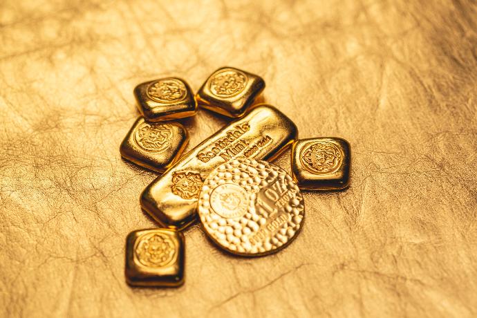 a bunch of gold bars sitting on top of a table